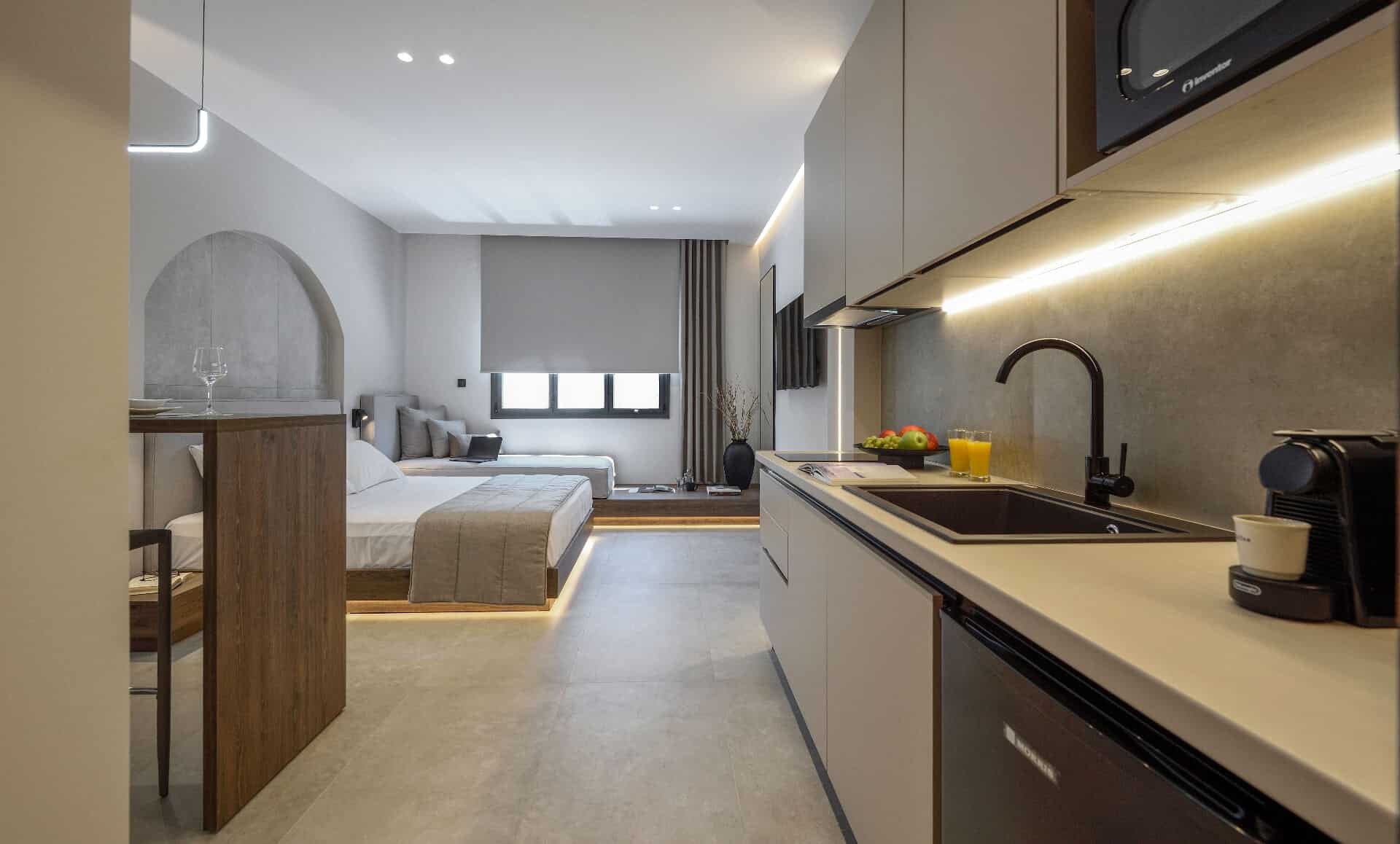 The suite's sleeping area and kitchen in one flow