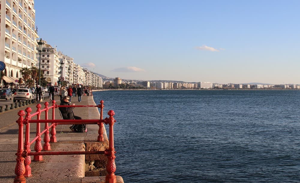 Thessaloniki waterfront promenade in winter, with the White Tower in the distance
